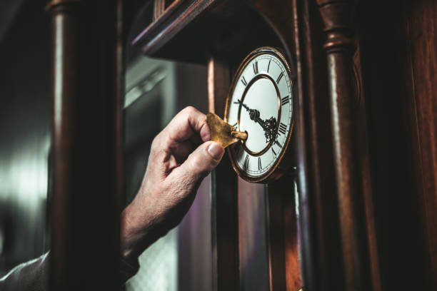 A luxurious Howard Miller Grandfather Clock, featuring a beautifully crafted wooden frame, intricate brass details, and a graceful pendulum, embodying timeless elegance and precision.